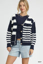 Navy Umgee cable-knit stripe button-up cardigan with front buttons, layered over a casual outfit for a cozy, stylish look.