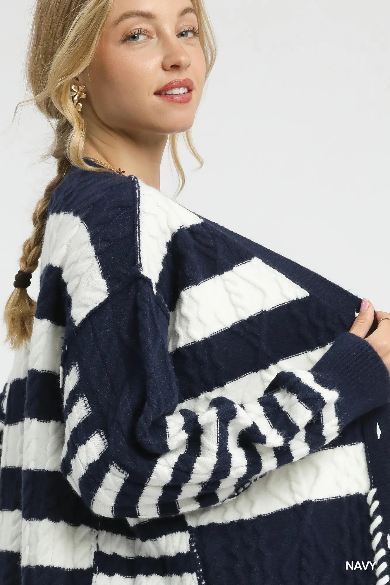 Navy Umgee Cable-Knit Stripe Button-Up Cardigan by Trendsi, featuring a cozy knit texture and classic striped pattern.