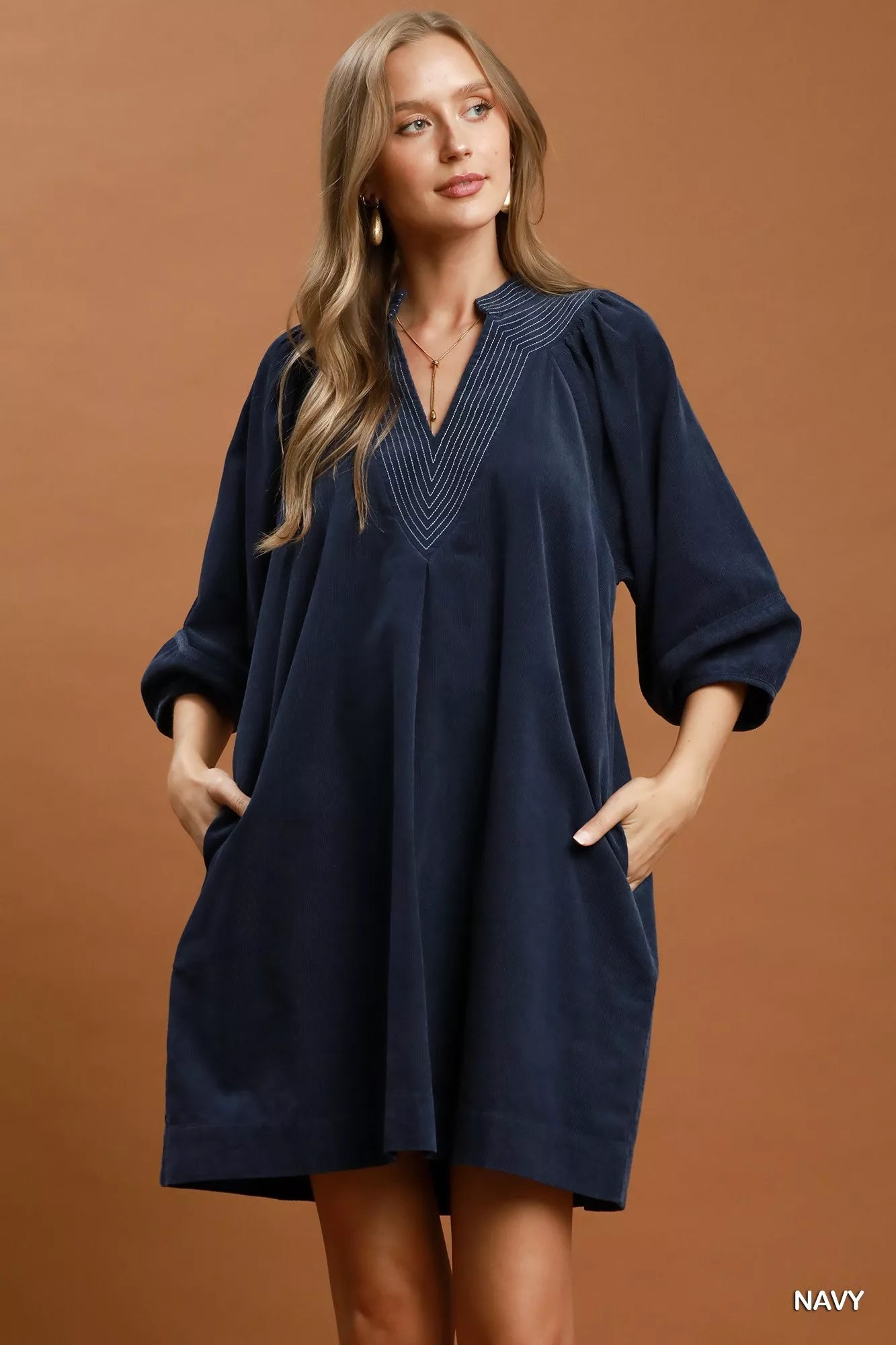 Navy Umgee corduroy V-neck puff sleeve shift dress with pockets, stylish and casual for everyday wear.