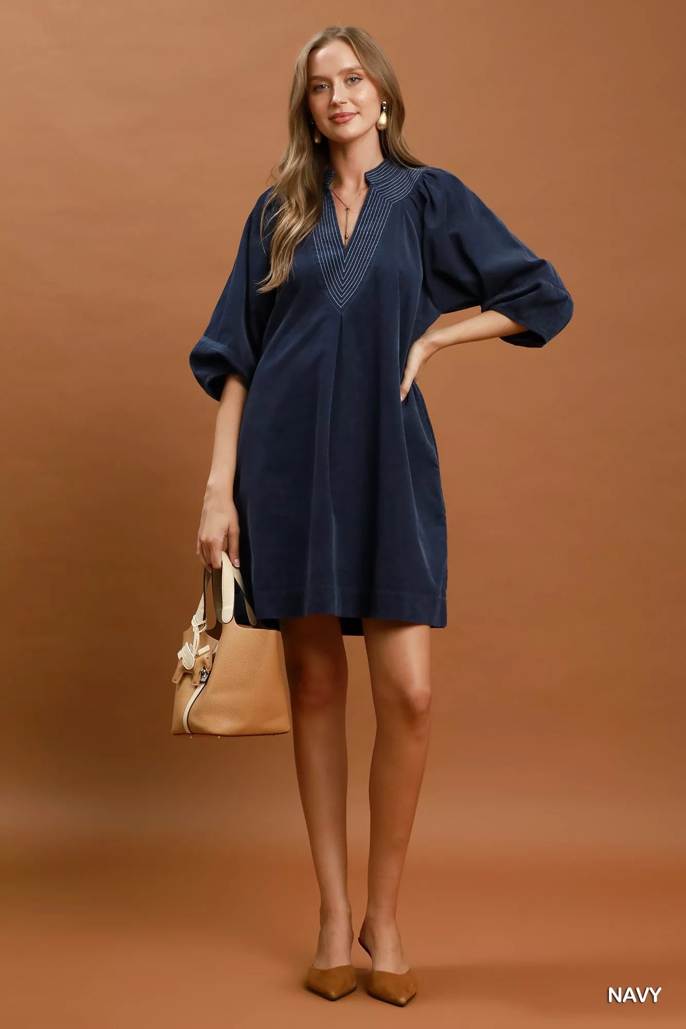 Navy Umgee corduroy V-neck puff sleeve shift dress with pockets, featuring a casual and stylish design.