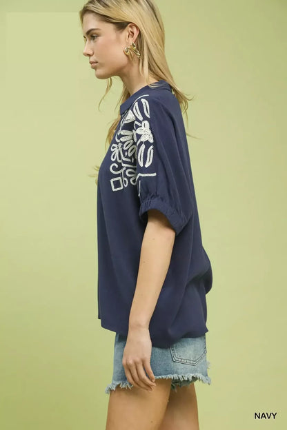Navy floral embroidered sleeve blouse by Umgee featuring lightweight fabric and feminine design.