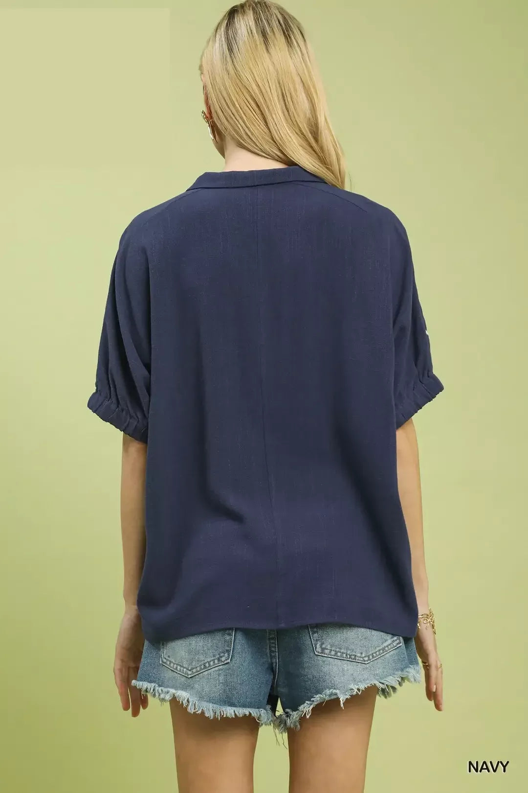 Navy floral embroidered sleeve blouse by Umgee featuring intricate embroidery on sleeves and a relaxed fit.