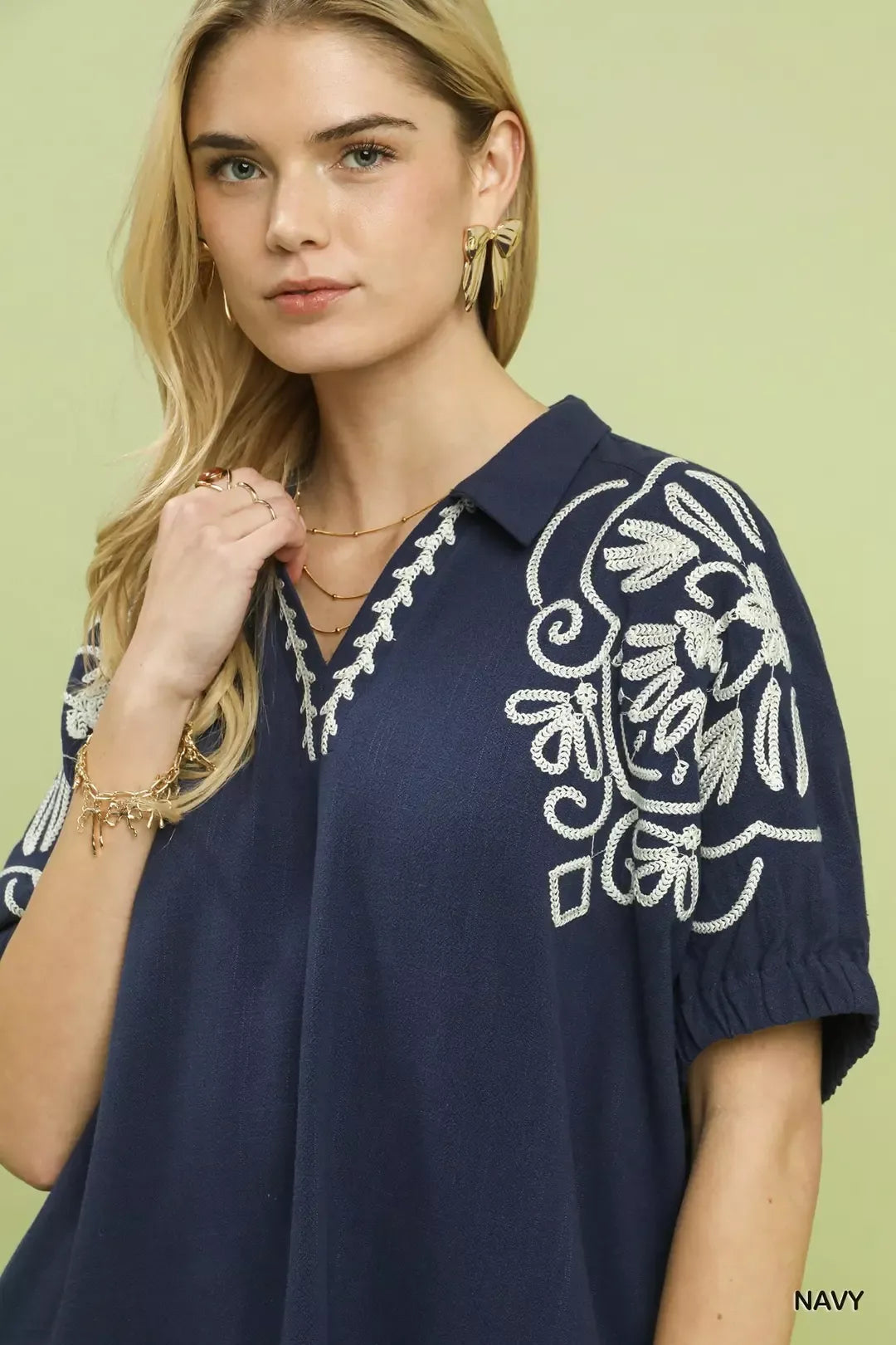 Navy floral embroidered sleeve blouse by Umgee, featuring intricate embroidery and a relaxed fit, perfect for casual wear.