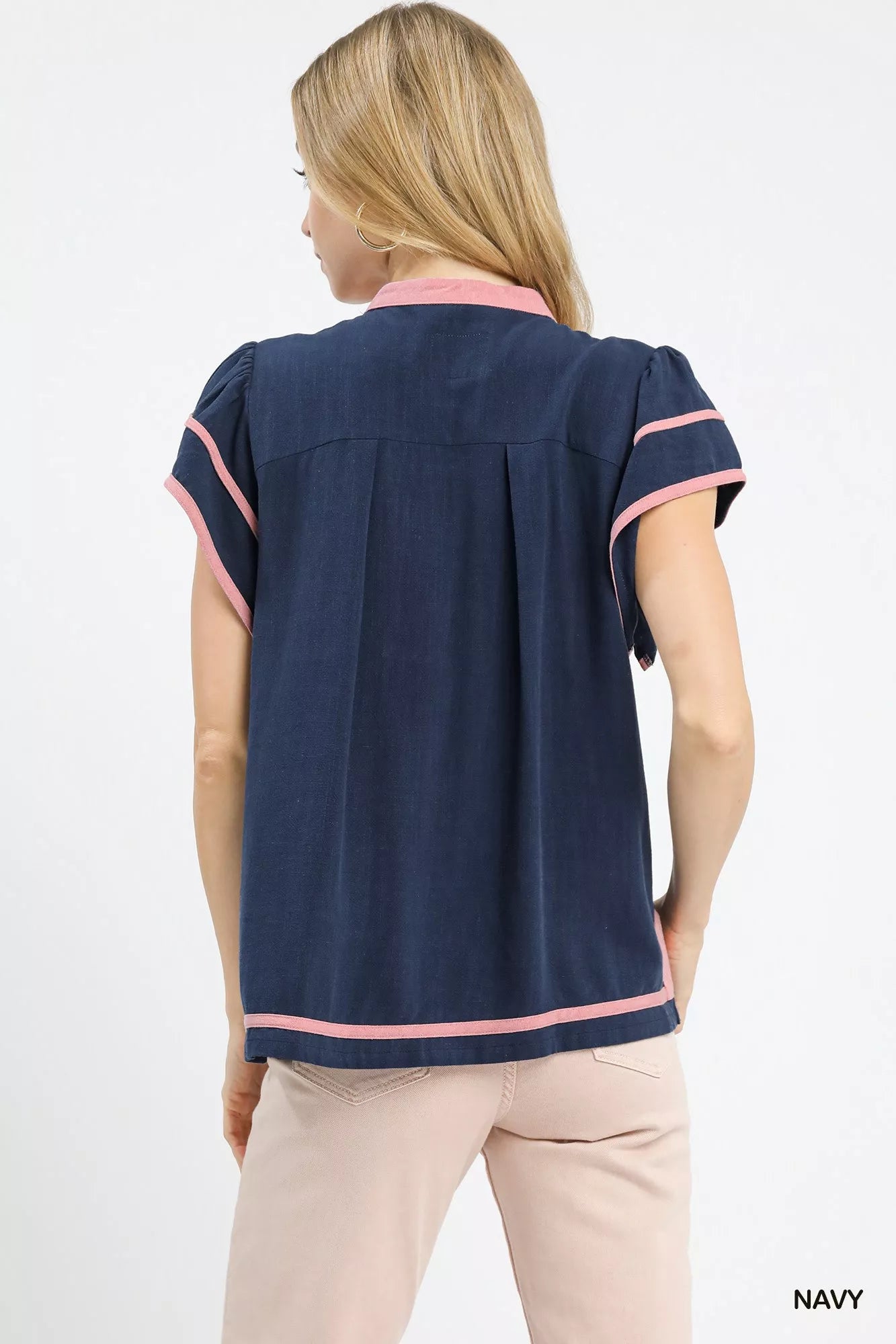 Navy linen ruffle sleeve top by Umgee with a relaxed fit and feminine ruffled sleeve design.