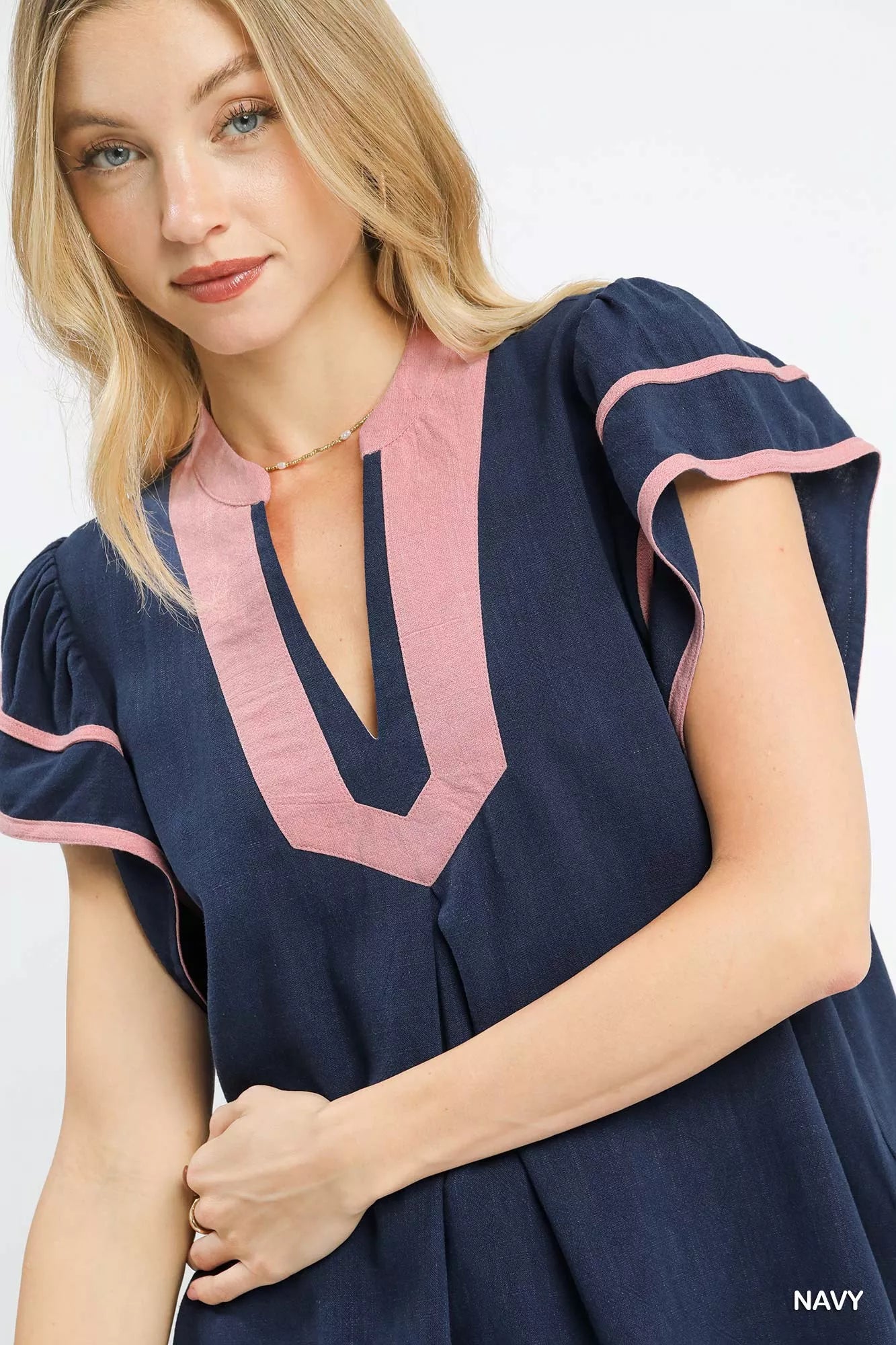 Navy linen ruffle sleeve top by Umgee featuring a relaxed fit and feminine ruffle details on the sleeves.