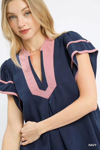 Navy linen ruffle sleeve top by Umgee featuring a relaxed fit and feminine ruffle details on the sleeves.
