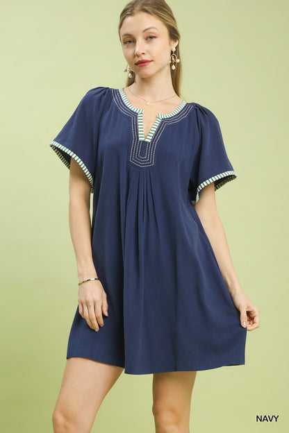 Navy Umgee linen trim tunic dress featuring a relaxed fit and stylish design, perfect for casual summer wear.