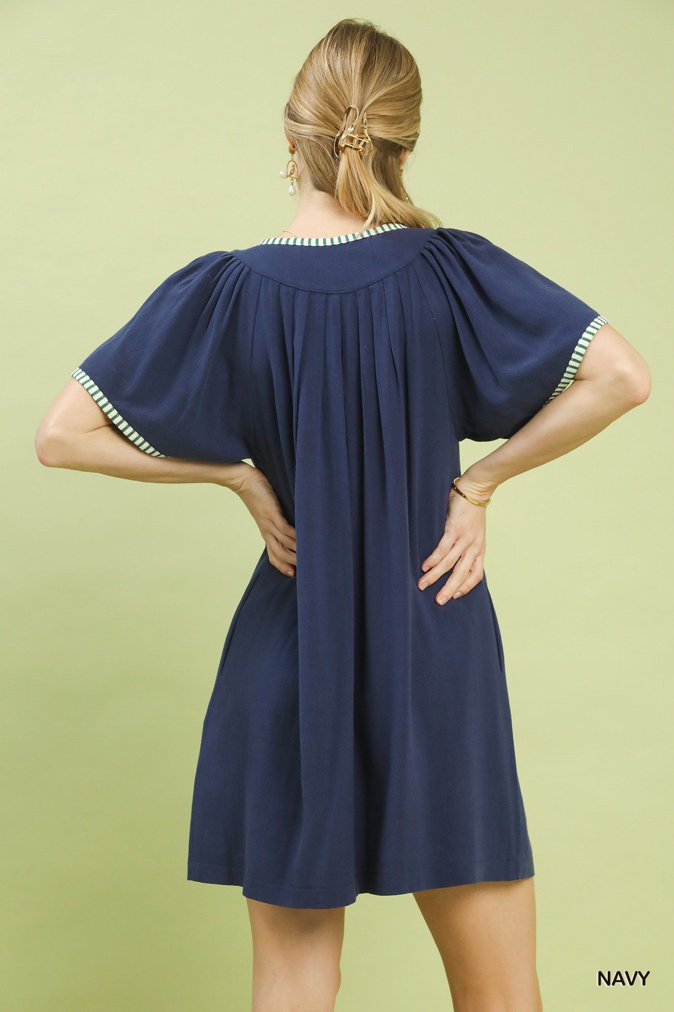 Navy Umgee linen trim tunic dress with relaxed fit and short sleeves, styled on a mannequin.