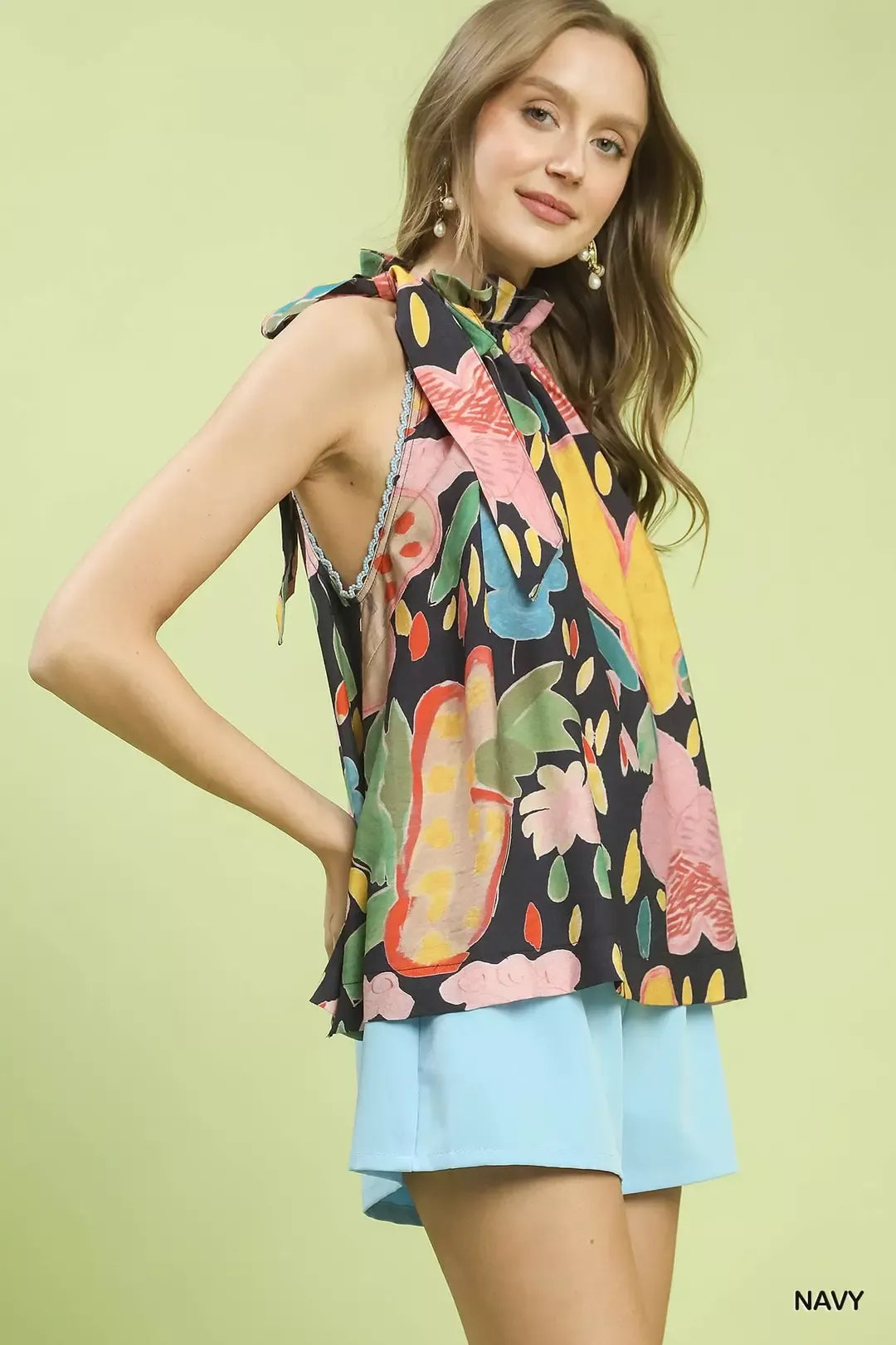 Multi-color floral boho halter neck top by Umgee featuring vibrant patterns and relaxed fit, perfect for casual summer outfits.