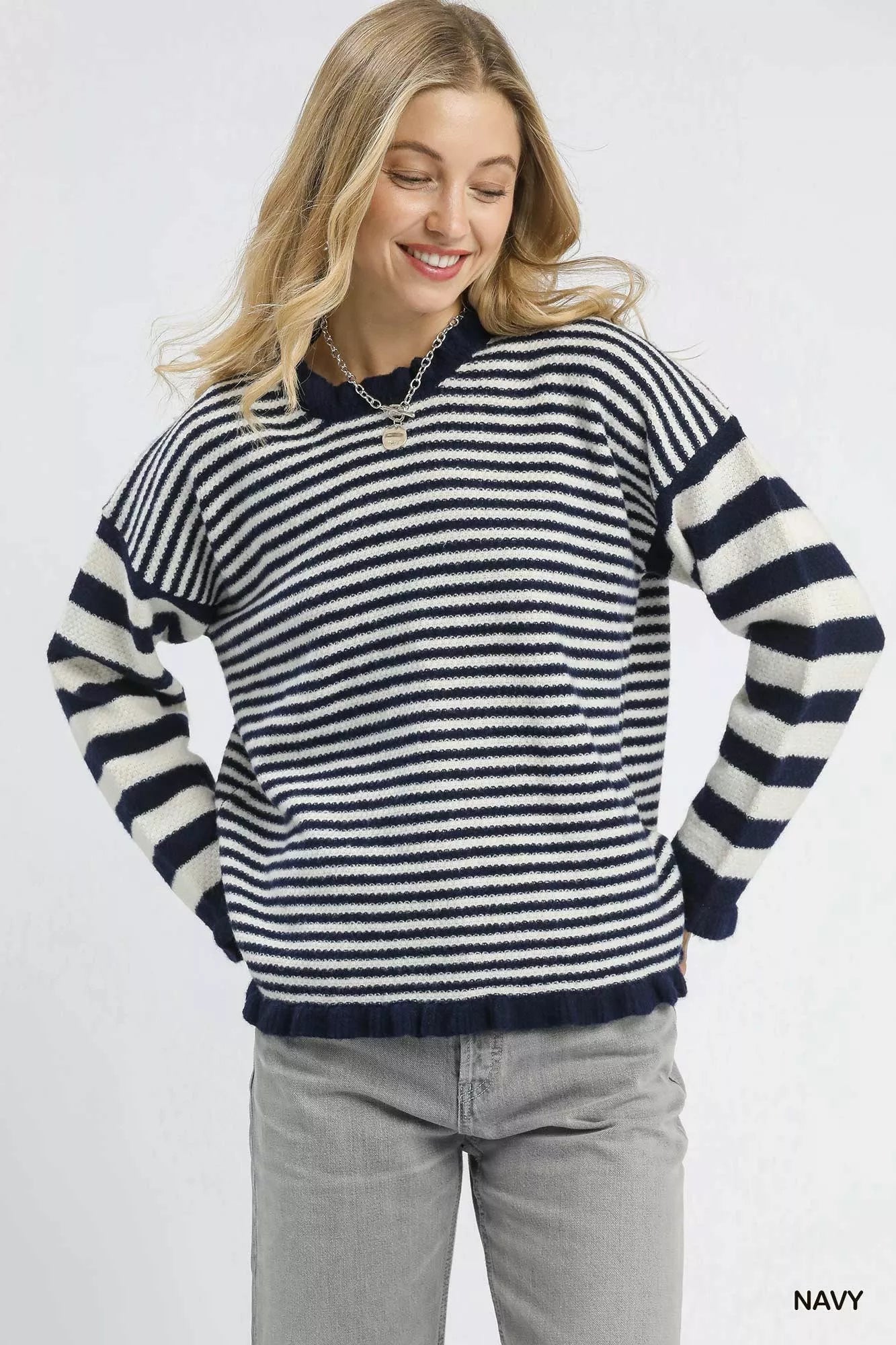Navy Umgee stripe sweater with ruffle neck and long sleeves, styled casually on a model.