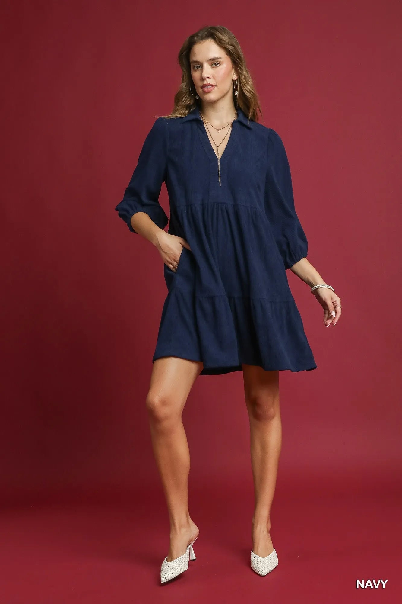 Navy Umgee tiered corduroy mini dress with balloon sleeves, stylish and casual for everyday wear.