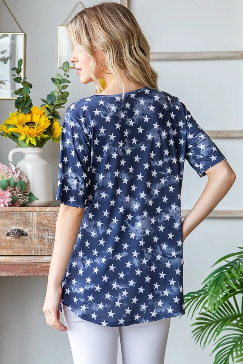 Navy Heimish full-size short sleeve crisscross star babydoll top with a relaxed fit and stylish star pattern.