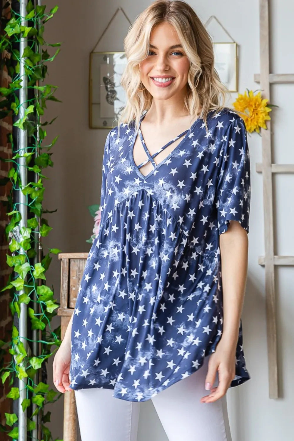 Navy Heimish short sleeve crisscross star babydoll top by Trendsi, featuring a relaxed fit and star pattern on soft fabric.