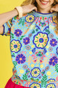 Navy Umgee retro floral puff sleeve top with ruffled cuffs, lightweight fabric, and vintage-inspired design.