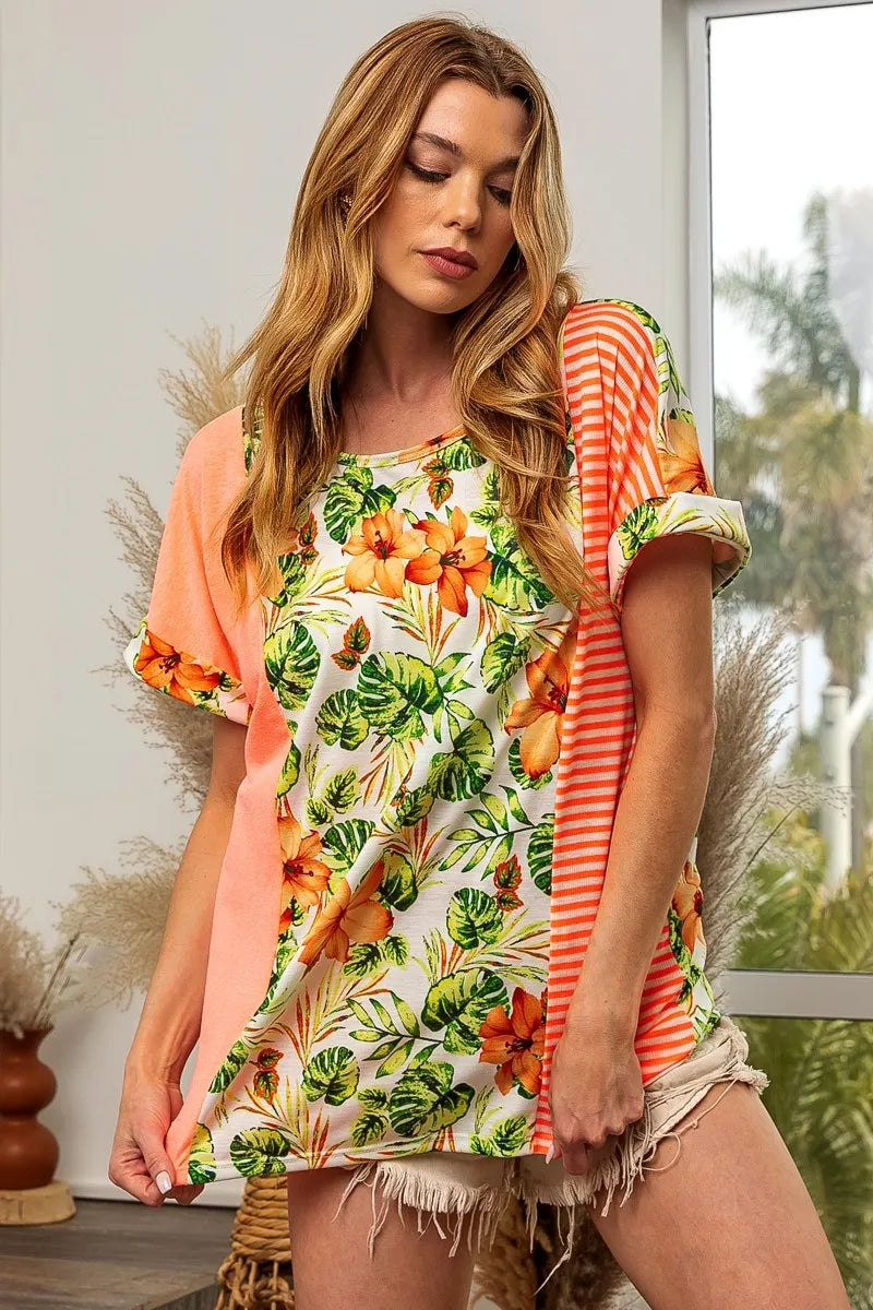 Neon orange and white floral stripe color block dolman sleeves top by Trendsi, featuring a relaxed fit and vibrant design.