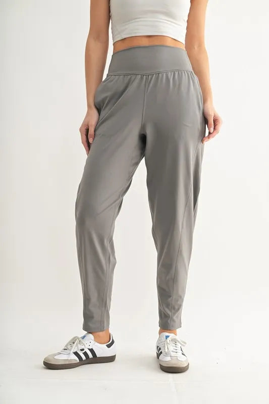 Trendsi MONO B Flowbarrel high waist active pants in pewter, showcasing a sleek, fitted design for workout or casual wear.