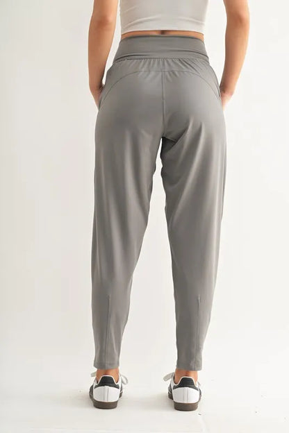 Trendsi MONO B Flowbarrel high waist active pants in pewter, showcasing their sleek fit and comfortable athletic design.