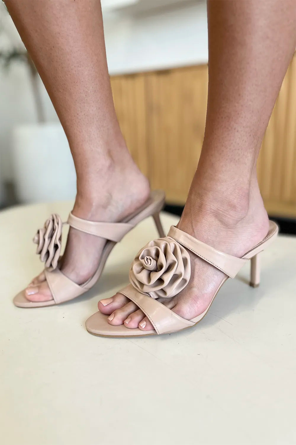 Nude Weeboo Flower PU Leather Stiletto Heel Sandals by Trendsi, featuring floral details and sleek design.