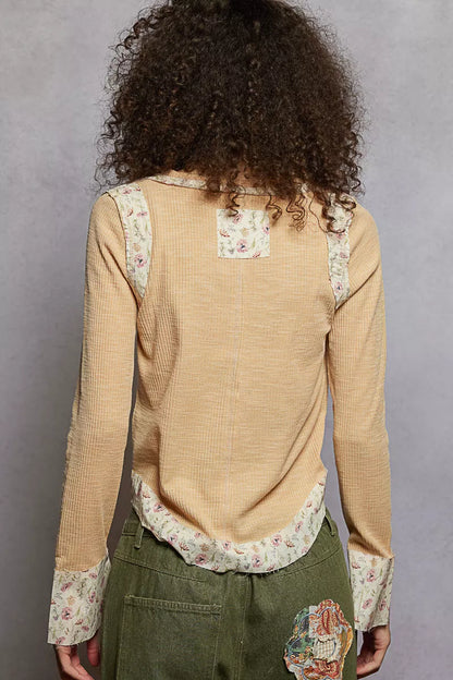 Nude beige ribbed long sleeve V-neck top with floral patch detail, stylish and fitted from Trendsi.