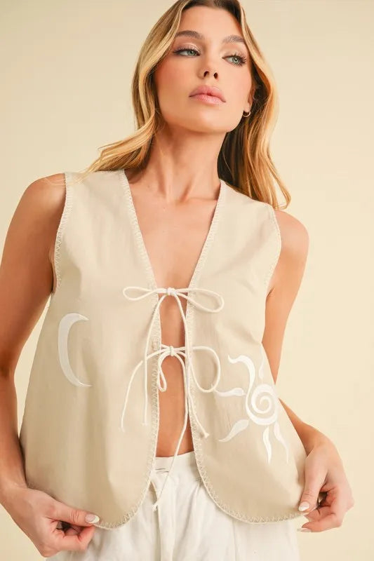 Aemi+Co embroidered tied front vest coat in oatmeal color, stylish and lightweight with intricate embroidery details.