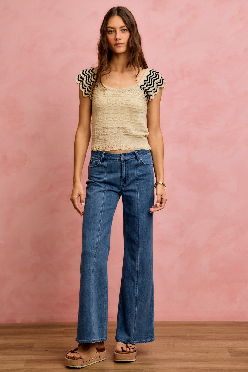 Oatmeal black SO ME wavy textured knit top with fluttered sleeves, stylish and cozy for casual wear.