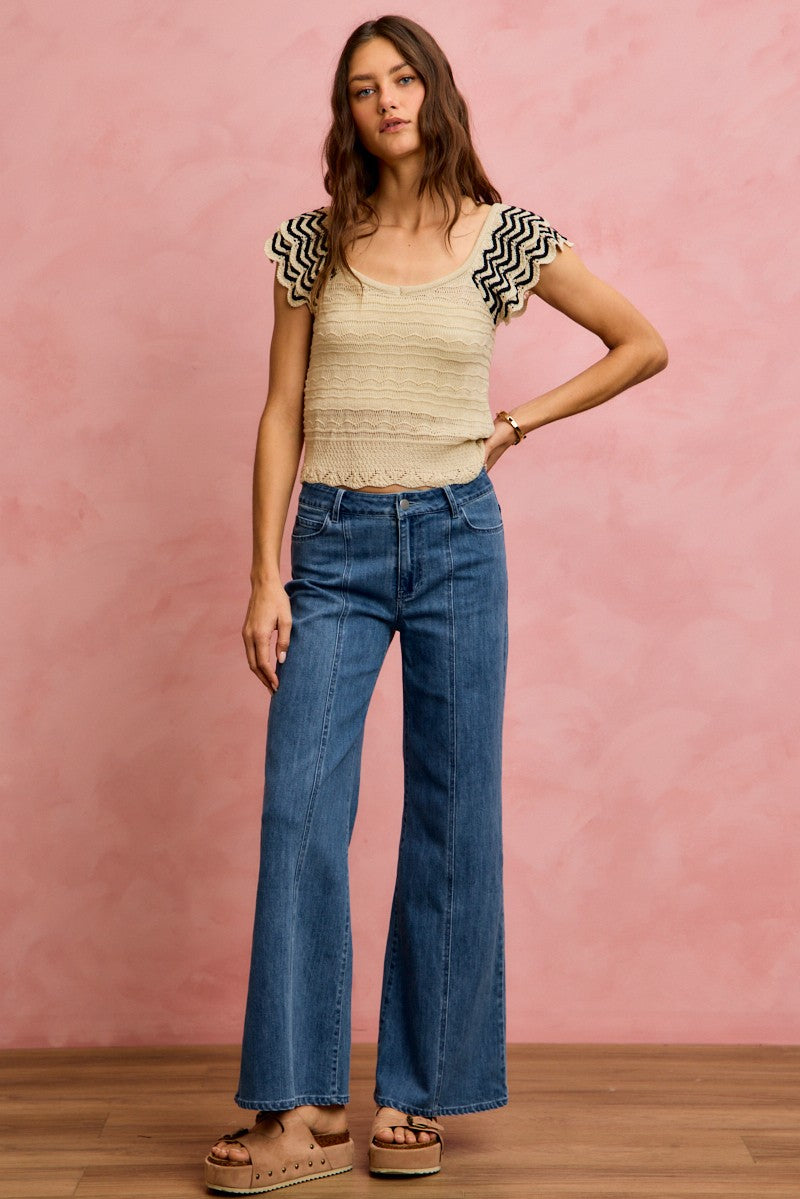 Oatmeal and black SO ME wavy textured knit top with fluttered sleeves, stylish and cozy women's sweater from Trendsi.