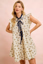 Oatmeal navy BiBi floral multi-tiered dress by Trendsi with ruffles and front tie, styled for a feminine, boho look.