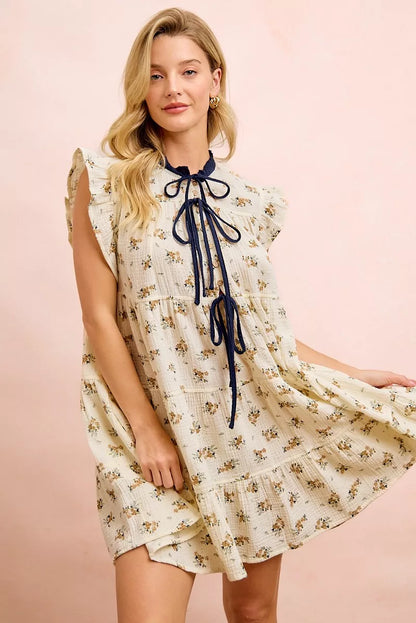 Oatmeal navy BiBi floral multi-tiered dress with ruffles and front tie, trendy women's dress by Trendsi.