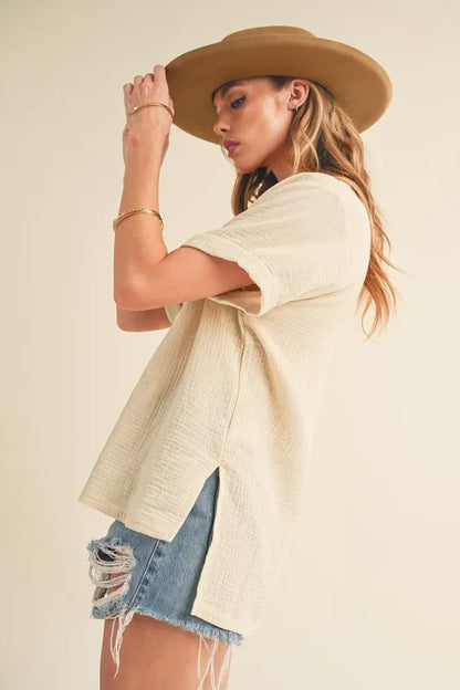 Oatmeal Aemi + Co cotton gauze blouse with side slit, Johnny collar, short sleeves, stylish and lightweight for casual wear.
