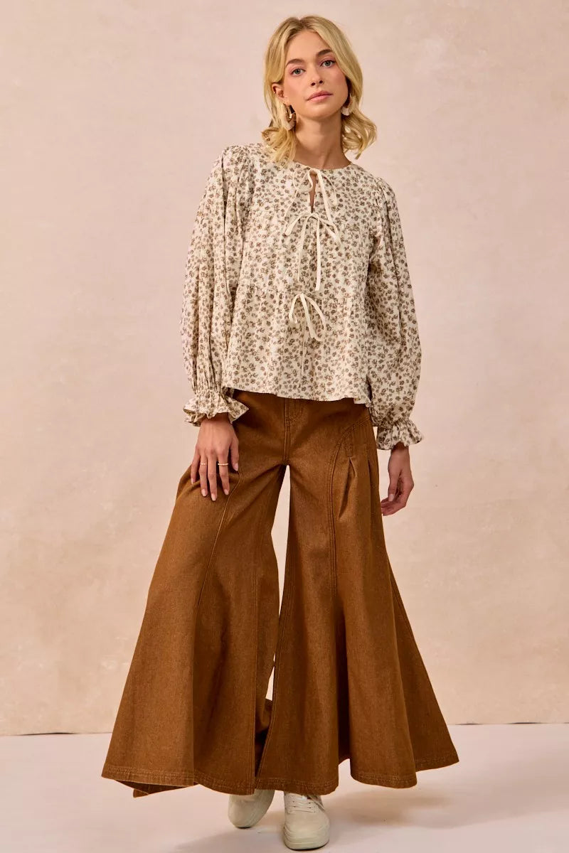 Oatmeal BiBi floral printed peplum blouse with shirring and tied front, featuring a feminine and stylish design by Trendsi.