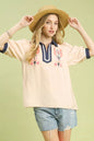 Oatmeal Umgee embroidered puff sleeve top with contrast trim, featuring intricate embroidery and stylish puff sleeves.