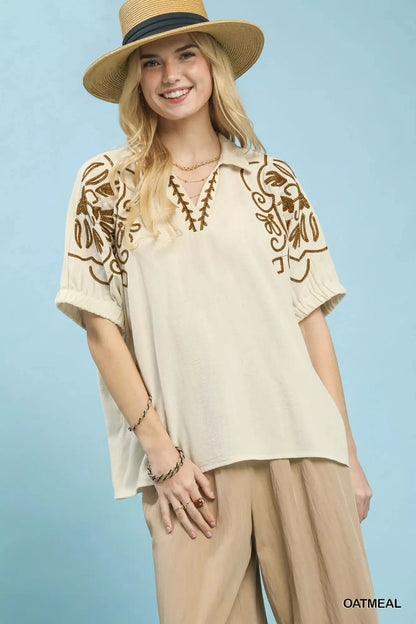 Oatmeal floral embroidered sleeve blouse by Umgee with puffed sleeves and delicate embroidery, perfect for casual and chic looks.