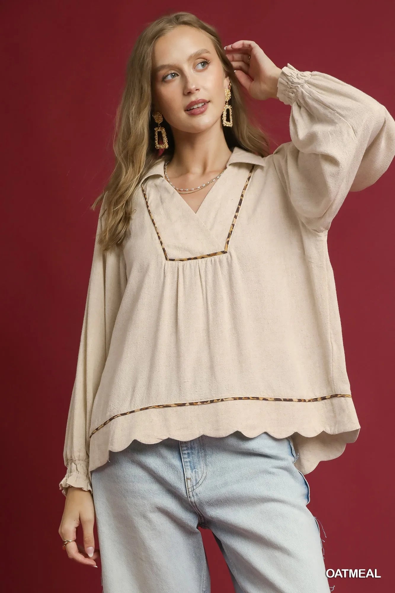Plus size Umgee linen blouse with scallop hem and contrast trim, featuring a relaxed fit in oatmeal color.