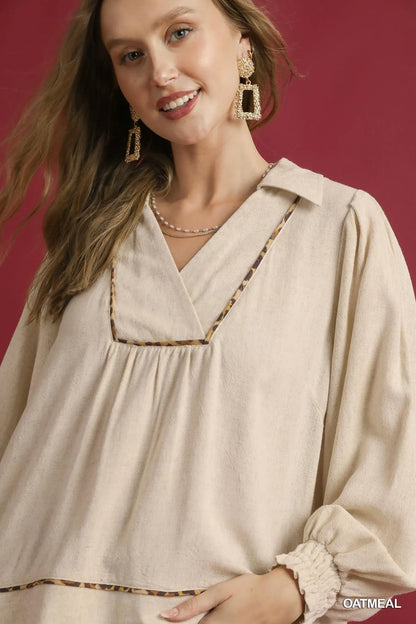 Plus size Umgee linen blouse with scallop hem and contrast trim, featuring a relaxed fit and stylish design for casual wear.