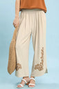Oatmeal linen embroidered wide-leg boho pants by Umgee, featuring relaxed fit and intricate embroidery details.