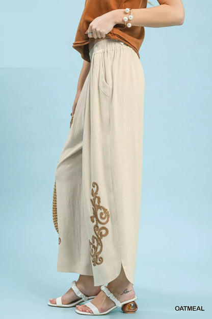 Oatmeal linen embroidered wide-leg boho pants by Umgee, featuring relaxed fit and intricate embroidery details.