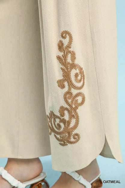 Oatmeal linen embroidered wide-leg boho pants by Umgee featuring relaxed fit and intricate embroidery details.