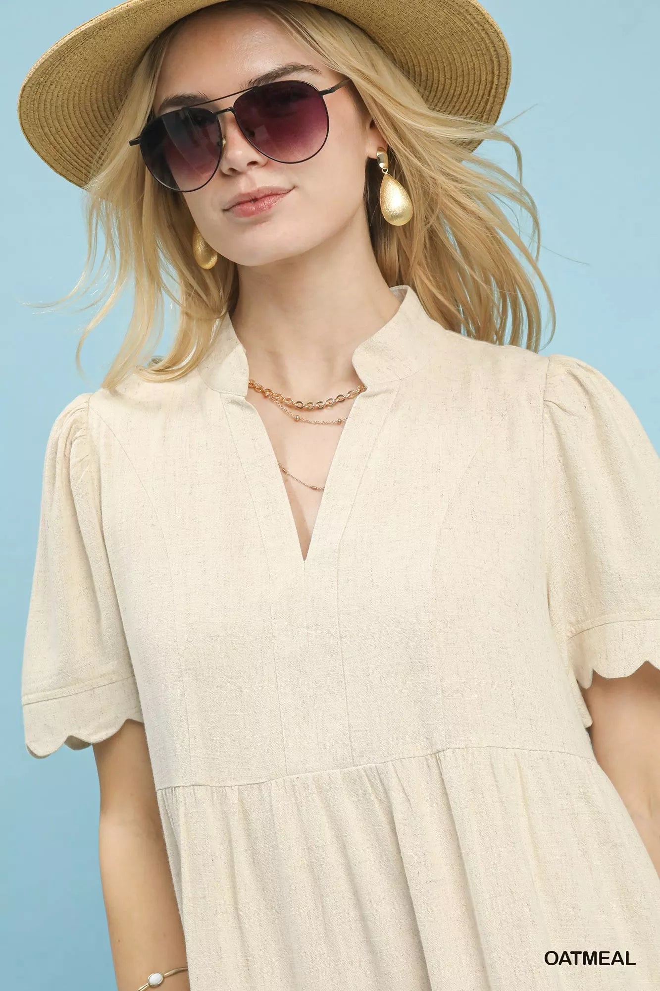 Oatmeal Umgee linen tiered babydoll dress with scalloped sleeves, featuring a relaxed fit and feminine style.