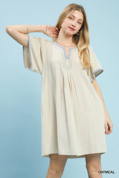 Oatmeal linen trim tunic dress by Umgee featuring a relaxed fit and casual style, perfect for warm weather wear.