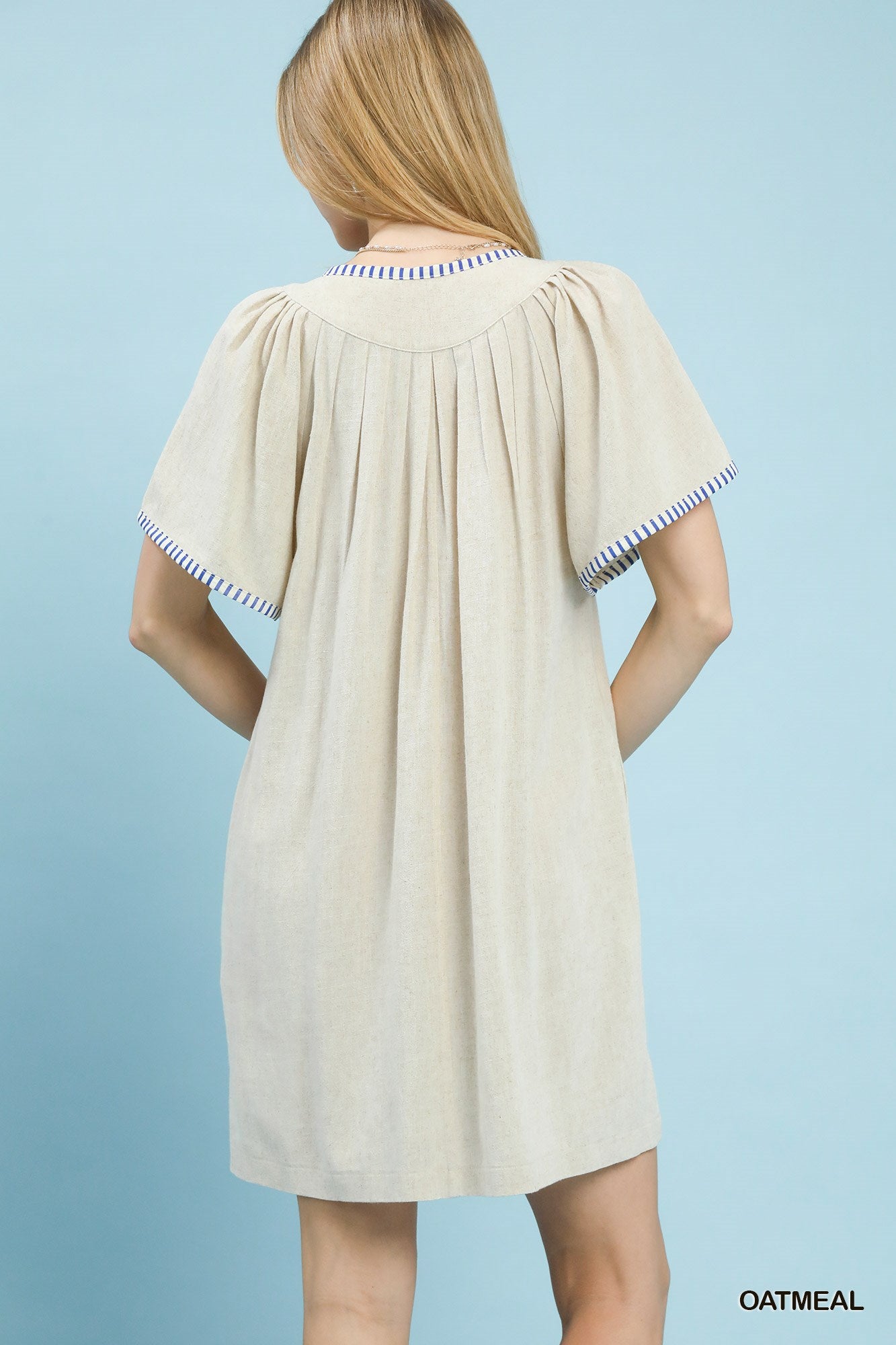 Oatmeal linen trim tunic dress by Umgee featuring a relaxed fit and casual style, ideal for everyday wear.