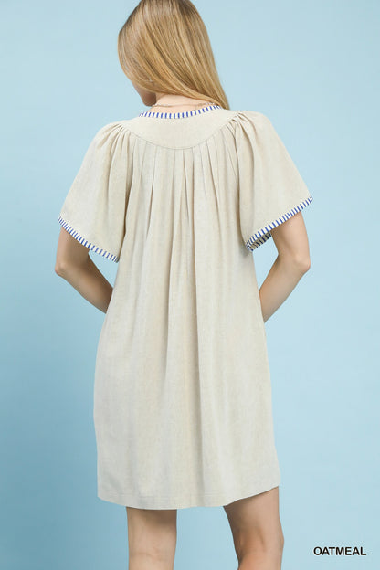 Oatmeal linen trim tunic dress by Umgee featuring a relaxed fit and casual style, ideal for everyday wear.