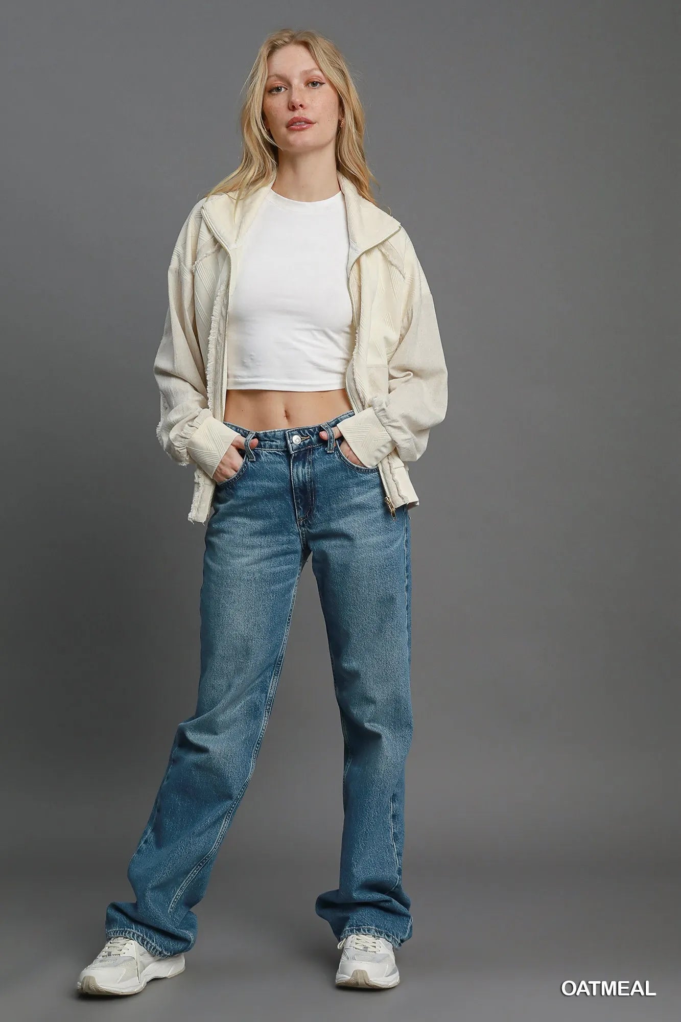 Oatmeal Umgee Two-Way Jacquard Zip-Up Jacket with textured pattern, front zipper, and collar, shown on a model.
