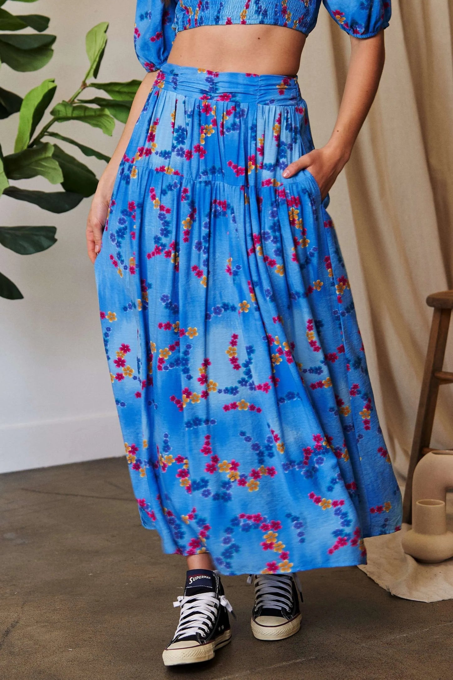 Ocean blue Davi & Dani printed maxi skirt with smocking waistband and ruffled hem, perfect for casual and summer wear.