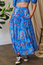 Ocean blue Davi & Dani printed maxi skirt with smocking waistband and ruffled hem, perfect for casual and summer wear.