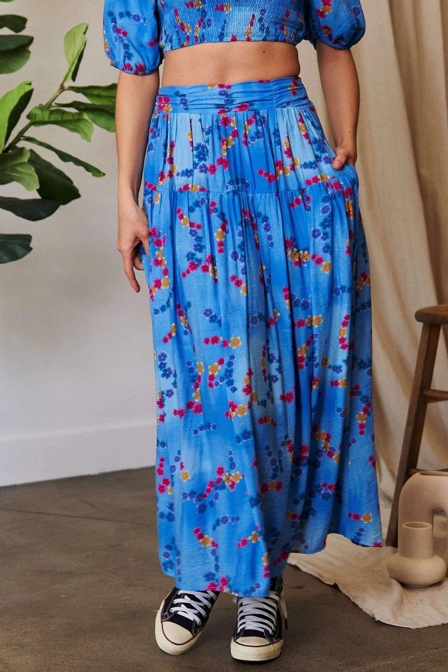 Ocean blue Davi & Dani printed maxi skirt with smocking waistband and ruffled hem, stylish and flowy for a boho look.