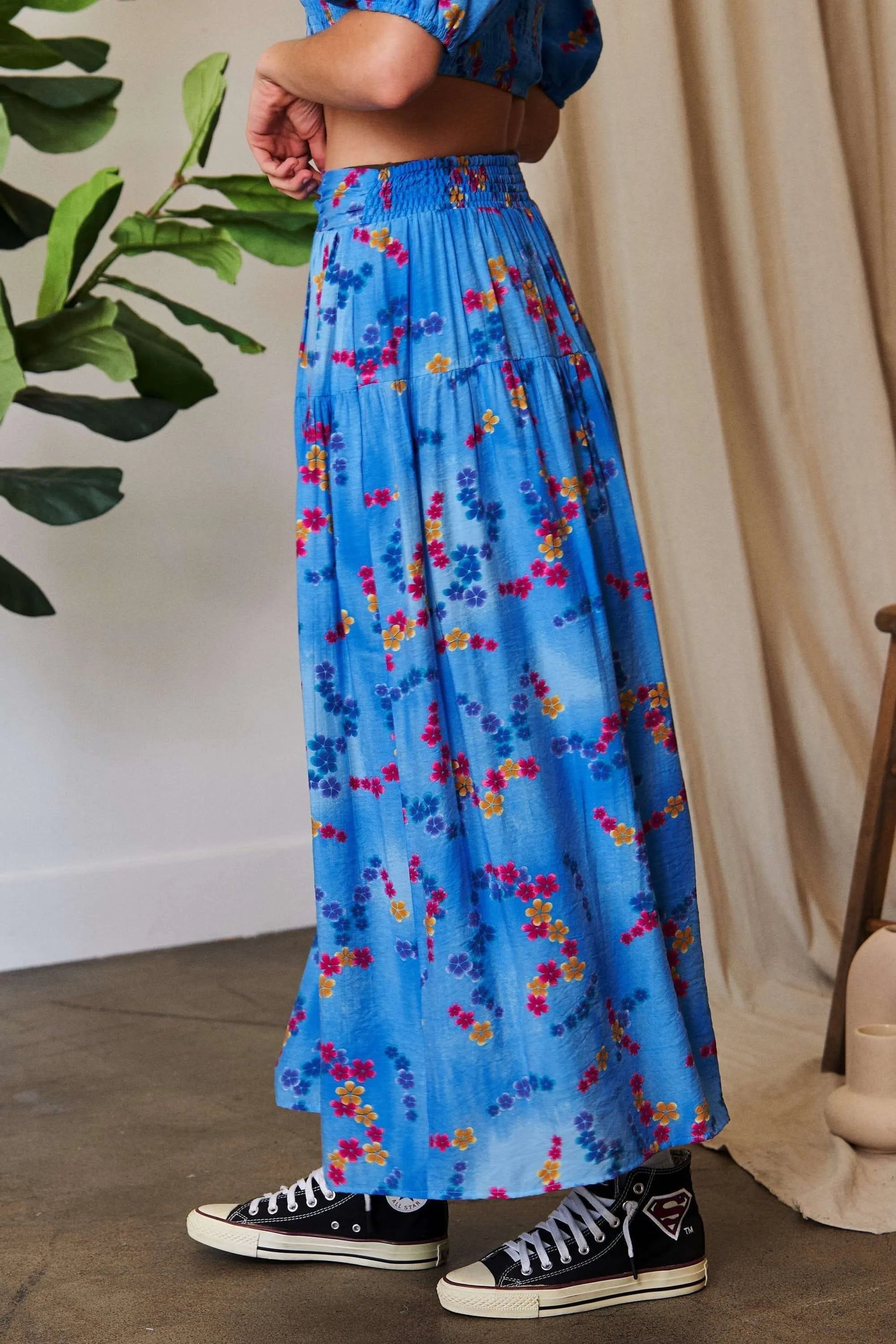 Ocean blue Davi & Dani printed ruffled maxi skirt with smocking waistband, flowing and stylish for a casual or dressy look.