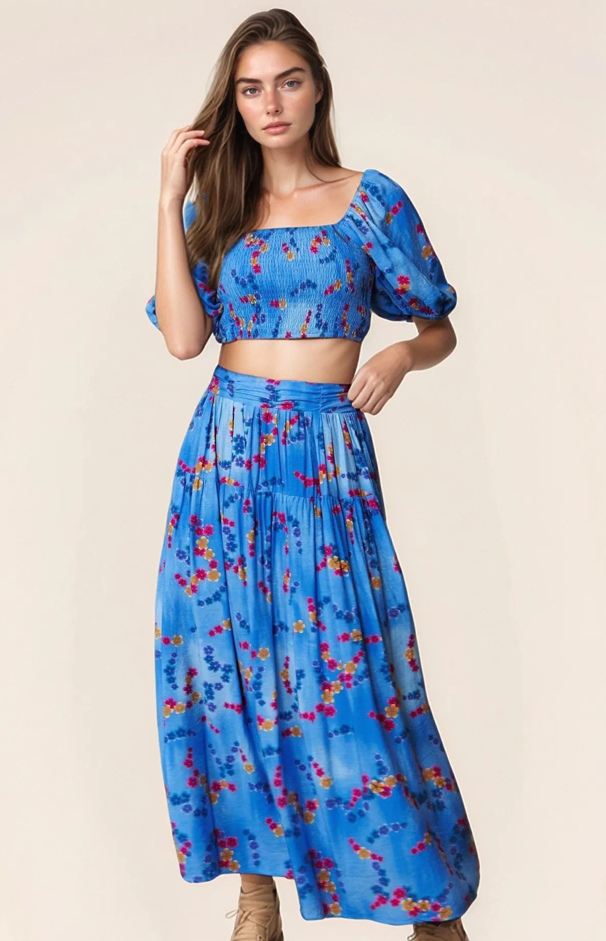 Ocean blue Davi & Dani printed maxi skirt with smocking waistband and ruffled hem, perfect for a stylish summer look.