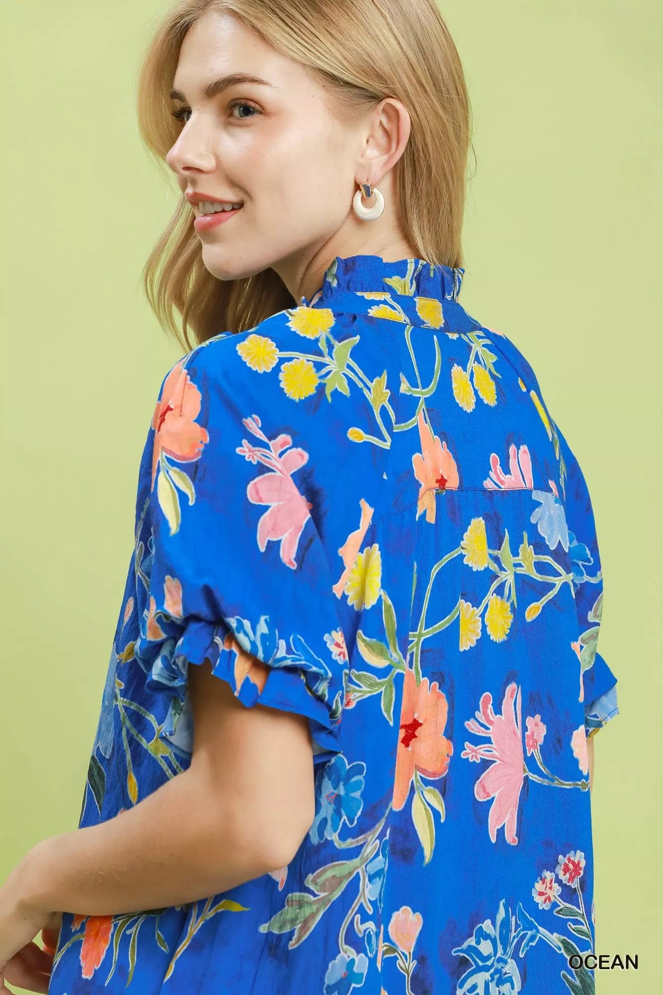 Umgee floral ruffle hem mini dress featuring a vibrant floral pattern and feminine ruffle details, perfect for casual or summer wear.