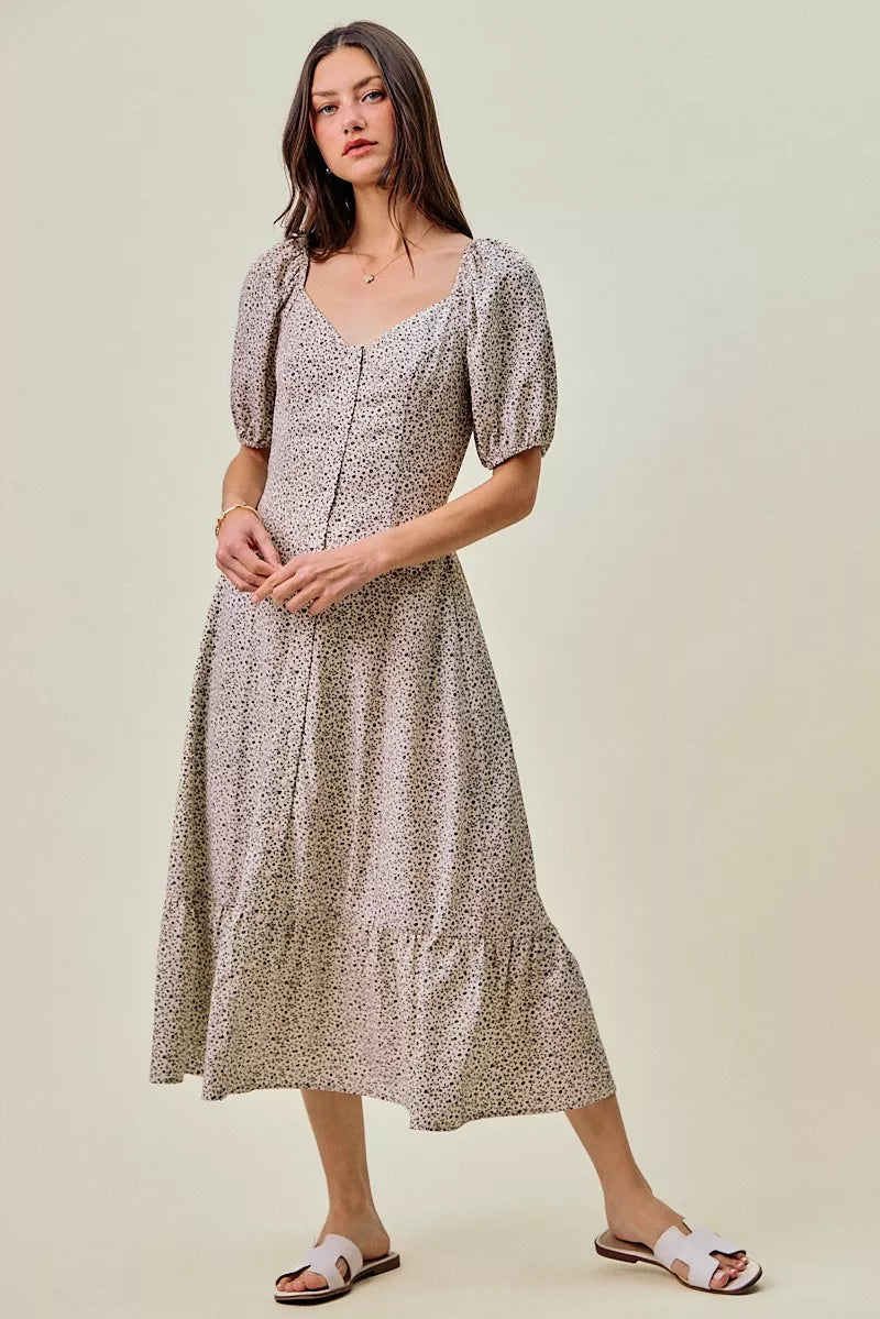 Off-white and black SO ME floral maxi dress by Trendsi featuring a self belt and elastic waist, perfect for casual or summer wear.