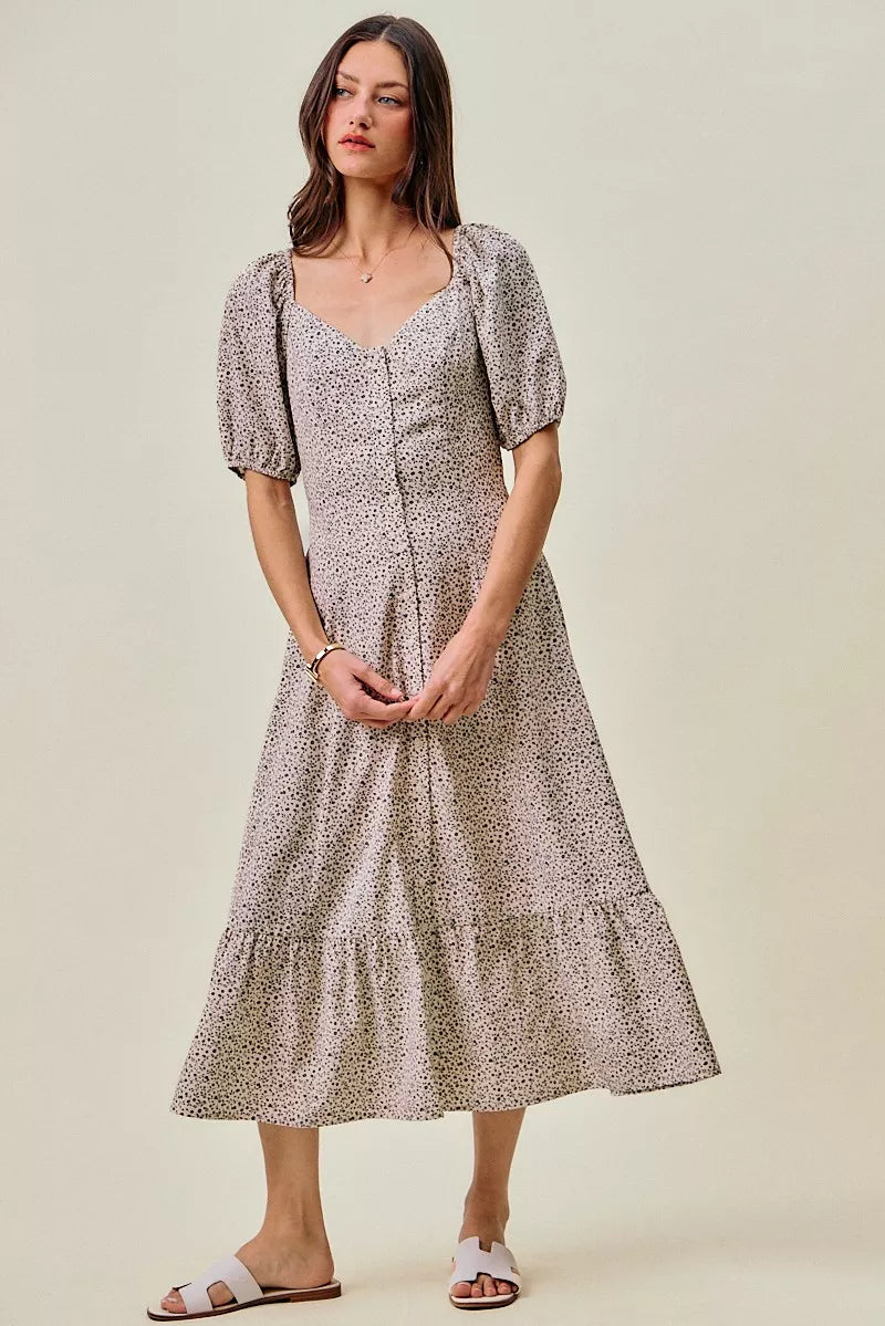 Off-white and black ditsy floral maxi dress by Trendsi with self-belt and elastic waistband, flowing and feminine for casual wear.
